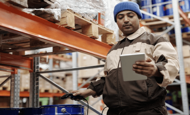 Worker measuring warehouse KPIS